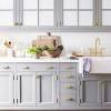 Or, you could always add a glass panel to cabinet doors to open up your cabinets, as this blogger did. 3
