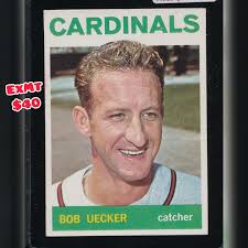 The only two times Bob Gibson ever smiled: 1) his rookie card 2) when Bob  Uecker and he held hands as a goof in this legendary 1964 team photo. We  all know