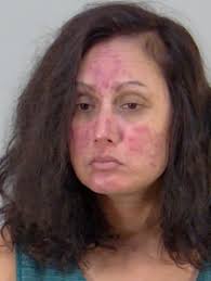 Woman charged with battering and pouring beer