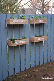 This cream house looks great with the coordinating cream fence to match. How To Make A Hanging Fence Garden Thrift Diving Blog