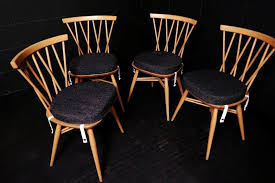 Ercol wooden dining furniture in solid elm, beech, ash or oak is perfect for dining tables, dining chairs and other furniture for your dining room or dining area. Ercol Dining Seat Cushions