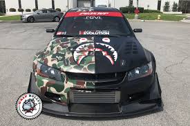 Wrapping your car in camo is sure to have that wow factor. Mitsubishi Evo Custom Camo Wrap Wrap Bullys