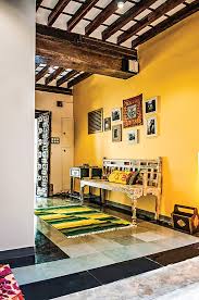 The Yellow Of The Wall In Combination With The Polished Kota Stone Flooring Renders Warmth And A Welcoming Ambiance T Home Decor Kota Stone Flooring Cozy House
