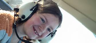 Volunteers make Dreamflight photo albums for 192 children