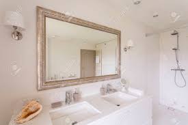 minimalist bathroom with large mirror