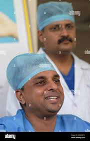Chief orthopedic surgeon Dr. Sharan Patil, foreground addresses the media  after the completion of 24-hour operation