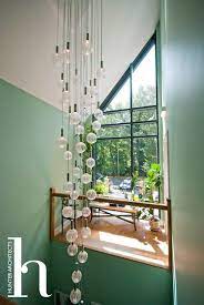 Double Height Entrance Hall By Riba Self Build Architects In Manchester Custom Made Glass Feature Lighting House Design Architect Design Entrance Lighting