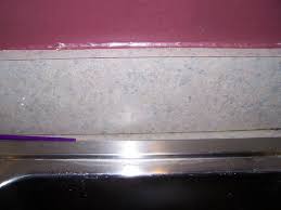 This is the video to watch. Replacing A Linoleum Backsplash Diy Home Improvement Forum