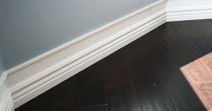 Get Bigger Baseboards Without Ripping All Your Old Ones Out By Adding Small Molding A Few Inches Above And Paint Wall Space Baseboards Home Diy Home Remodeling