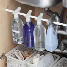 add a tension rod under your sink to