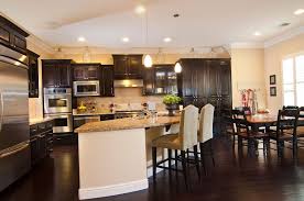 There are two options to balance the dominant colors. 2019 Hot Trends For Choosing Kitchen Countertop And Cabinet Colors Dark Kitchen Kitchen Flooring Dark Wooden Floor