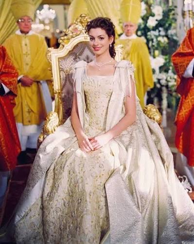 Following the exciting and long awaited confirmation of Princess Diaries 3, let's revisit seven unforgettable looks from Anne Hathaway as Mia Thermopolis that capture timeless elegance. From her iconic ball ruby red