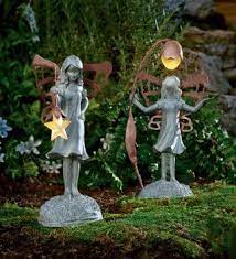 Amazon Com Flower Fairy Garden Statue With Solar Lantern Patio Lawn Garden Fairy Garden Garden Statues Garden Lighting Diy