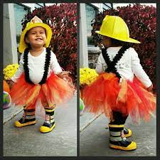 Make Firefighter Costume More Girly With Diy Tutu And Lace Suspenders Iron On Fire Rescue On The Back Firefighter Costume Girl Firefighter Diy Girls Costumes