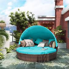 It features a sun cover, protecting you from sunshine. Topmax Patio Round Rattan Daybed With Retractable Canopy Blue