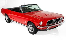 Their drivers stare at the red. 1968 Ford Mustang Convertible 289 Auto Ps