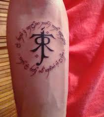 No music no life and the word music are spelled out in red and black ink over a collage of musical symbols in this bicep tattoo. All That Is Gold Does Not Glitter Not All Those Who Wander Are Lost My New Tattoo Lotr