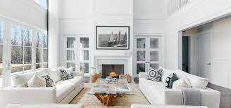 Design ideas for a large contemporary open plan living room in london with white walls, medium hardwood flooring, a hanging fireplace, a metal fireplace surround and brown floors. 17 White Living Room Decor Ideas Sebring Design Build