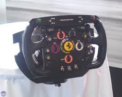 Wer in der formel 1 mithalten. F1 2011 Thrustmaster Veroffentlicht Formel 1 Lenkrad Fur Die Neue Rennsimulation