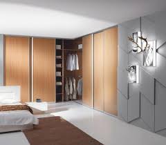 This grand wood armoire makes a beautiful corner furniture piece for this bedroom. L Shaped Wardrobes Corner Wardrobes