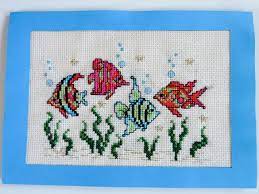 This nautical themed design features a sailor's outfit, shells, fish, anchor, and more! Weezepoel Tropical Fish Cross Stitch