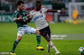 The incidents resulted in the first gun. Vinicius Jr Of Flamengo Vies The Ball With Lucas Lima Of Palmeiras Junior Lucas Running