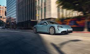 Porsche's robert meier told automotive news that the taycan would be priced between the cayenne suv and. Photos Porsche S Less Expensive All Electric Taycan Sports Car