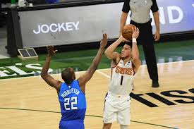 Phoenix suns' deandre ayton (22) shoots against milwaukee bucks' jrue holiday (21) during the first half of game 3 of basketball's nba finals, sunday, july 11, 2021, in milwaukee. Bucks Vs Suns Prediction Odds Spread Line Over Under For Game 1 Idea Huntr