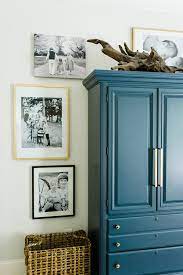 These custom formal & casual rooms were created by top designers and feature gorgeous furniture, outdoor views, and lavish decor. I Like The Large Piece Of Driftwood On Top Of The Armoire How To Decorate Around And On Top Of Tall F Tall Furniture Armoire Decor Decorating Top Of Armoire