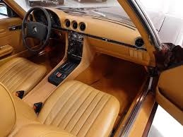 The 1977 Mercedes Benz 450sl Roadster Featured Here Is Finished In Gorgeous Milan Brown Metallic With An Impeccably Kept Saffron Ta Benz Mercedes Mercedes Benz
