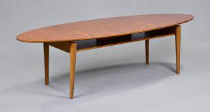 Its walnut veneer top, solid wood legs and brass brackets weather well over time. Lot Art Mid Century Modern Oval Coffee Table