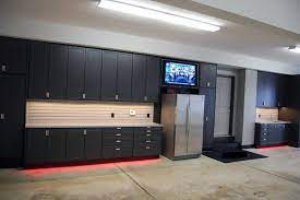 Masculine Home Garage Ideas Black Cabinet Storage Units With Fridge And Neon Lights Garage Wall Cabinets Garage Cabinets Ikea Garage Interior