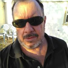 What is the purpose of the pile of logs outside Stalag 13 in Hogan's Heroes?