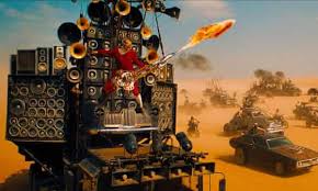 In ciuda convingerilor sale, se alatura unui grup de supravietuitori ai desertului, condusi de implacabila. Mad Max The Story Behind The Flame Throwing Scene Stealing Guitar Guy Mad Max Fury Road The Guardian