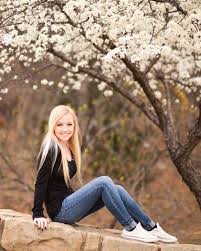 Flower Child In Chuck Taylors And A Prom Dresses Senior Picture Outfits Girl Senior Pictures Senior Girl Poses