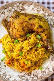 Add the chicken back to the pot and pour in the rest of the broth and tomato puree. Jollof Rice With Chicken A Nigerian Recipe Munaty Cooking