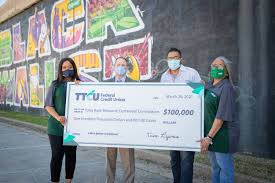 A mural depicts the horrors of the 1921 tulsa race massacre in the greenwood district. Ttcu Donates 100 000 To Tulsa Race Massacre Memorial Credit Union Journal American Banker
