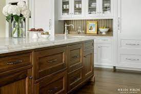 This look works really well for my cabinets, because the cabinet sides have a 1/4 inch inset where a thin piece of trim fits down in nicely. Would You Ever Do A Stained Not Painted Beadboard Backsplash