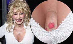 Dolly Parton reveals new flower tattoo nestled between her bosom at Joyful  Noise premiere | Daily Mail Online