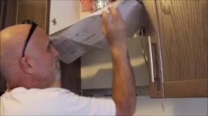 The microwave is installed over your cooktop and offers a clean seamless look to your kitchen. Microwave With Extractor Fan Installation Youtube