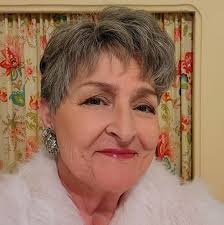 Doc Watson with his statue honoring his busking days in Boone, NC