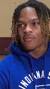 Cardinal Mooney head coach Carl Pelini and standout Dre Riley following the  win over East