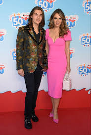 Calling out to bob dylan, he wrote. Elizabeth Hurley Wows In A Shocking Pink Dress As She Attends Kinder S 50th Anniversary With Son Damian