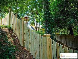 Install chain link fencing on a hill. Pin On New Landscaping