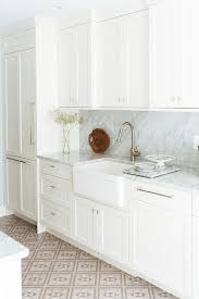 I think combination of wall paint which is pale pink with floor picture credit: White And Gray Kitchen With Tan Floor Tiles Transitional Kitchen