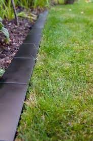 Flower bed borders give flower beds the perfect polished look, that any gardener aims for. Musta Reunus Lawn Sarmays Border Brick Style Modern Maisemointi Piha Easy Edge Ebay Brick Garden Edging Lawn Edging Modern Landscaping