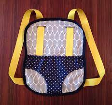 Diy Doll Baby Carrier So Easy Used Ribbon As Trim And Straps Straps Slip Through Button Holes So No Baby Doll Carrier Baby Accessories Diy Baby Doll Clothes