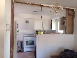 Cropped view of chocolatier holding chocolate molds near baking paper. Kitchen Bar Half Wall Kitchenzoid