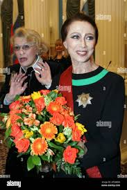Russian ballerina Maya Plisetskaya holds flowers during a presentation  ceremony of state awards in the Kremlin in Moscow, Thursday, Dec. 21, 2006.  Russian President Vladimir Putin presented state awards to public and