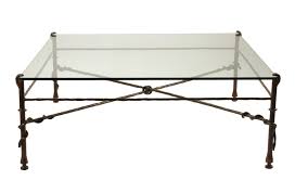 Give your space a modern yet rustic feel with this coffee table. Robert Morrissey Antiques Giacometti Inspired Wrought Iron And Glass Coffee Table